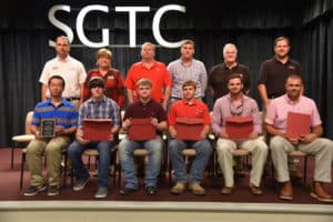 2.Seated, from left to right, are SGTC Student of Excellence nominees Feng Xie, Kaleb Tyler York, Alex Hill, Tyler Holt, Ben Adams, and Wesley Brazier. Standing, from left to right are nominating instructors Glynn Cobb, Lora Wiseman, Mike Collins, Tyler Wells, Phil Deese, and Ted Eschmann. Not pictured are nominee Jorge Lara and his instructor Gil Pittman. 