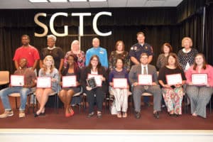 2.Seated from left to right are SGTC Student of Excellence nominees LaWarrior Gardner, Elizabeth Lumpkin, Judashia Eley, Linda Kent, Norma Hardester, Grady Barfield, Lindsey Massey, and Taylor Hatfield. Standing from left to right are nominating instructors Xavier Jackson, Dorothea Lusane-McKenzie, Teresa McCook, Ricky Watzlowick, Jaye Cripe, Terry Westbury, Diana Skipper, and Debra Smith. 