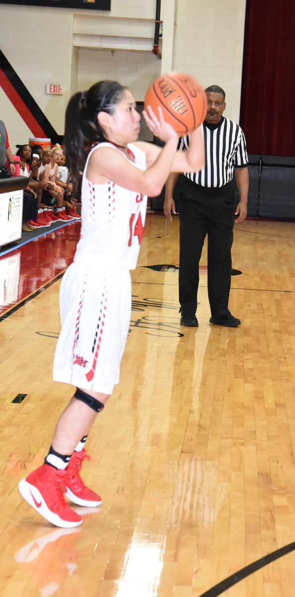 Kanna Suzuki (14), a freshman from Japan, is shown above shooting.  She was the top scorer for the Lady Jets in the match-up with Denmark Tech.