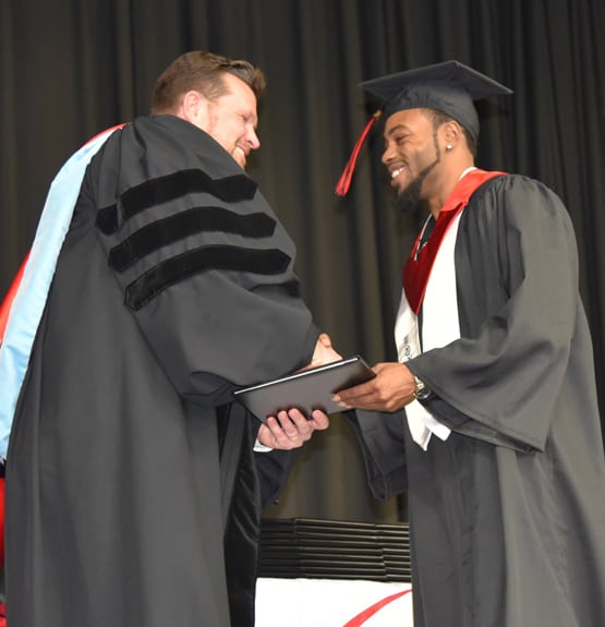 Racarda Blackmon of Americus was presented with his Networking Specialist Associate of Applied Science degree by SGTC President Dr. John Watford.