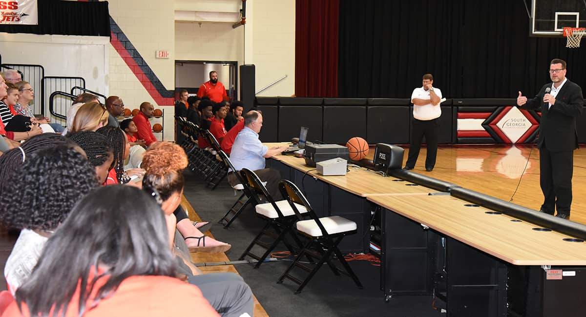 SGTC President Dr. John Watford is shown above welcoming individuals to the 2017 – 2018 Jets Kickoff event in the SGTC gymnasium.