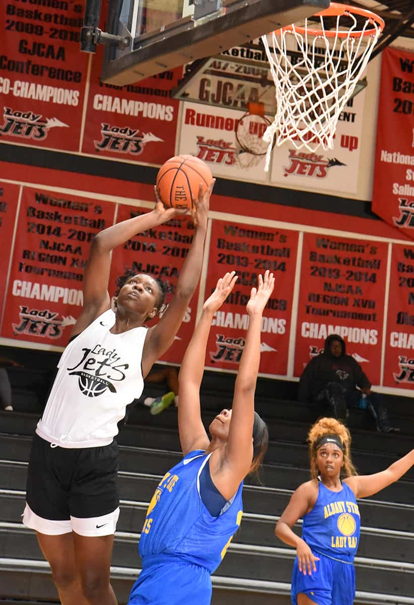 SGTC’s Esther Adenike, 24, shoots over an Albany State player for two points.