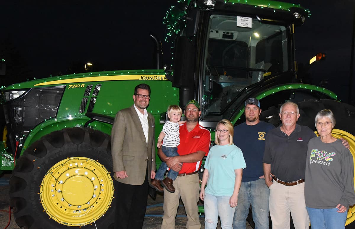 Dr. John Watford is shown above in front of a John Deere Tractor with SGTC John Deere Agricultural Technology Instructor Matthew Burks and Jayson Everett and his family as well as SGTC Board member Jake Everett and his wife Margie.  Jake is a two-time graduate of SGTC in Mechanical Technology and Computer Information Systems and his son Jayson, graduated with a degree in Computer Information Systems as well.  They recently endowed a scholarship in memory of their daughter, Rose Ann Everett.