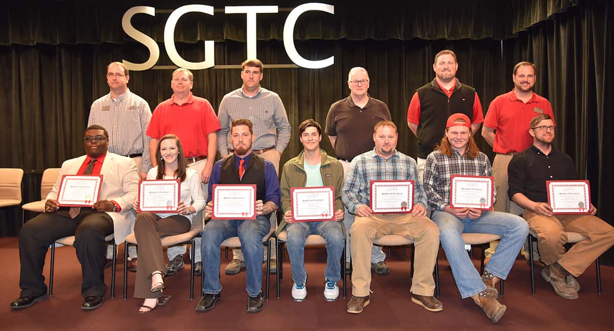 Seated from left to right are SGTC Student of Excellence nominees Shawn Tyson, Lacey Chandler, Charles Knoll, Charles Westra, Jason Fuller, Joel Barnes, and Joseph Woodham. Standing from left to right are nominating instructors Glynn Cobb, Mike Collins, Tyler Wells, Phil Deese, Chad Brown and Ted Eschmann.