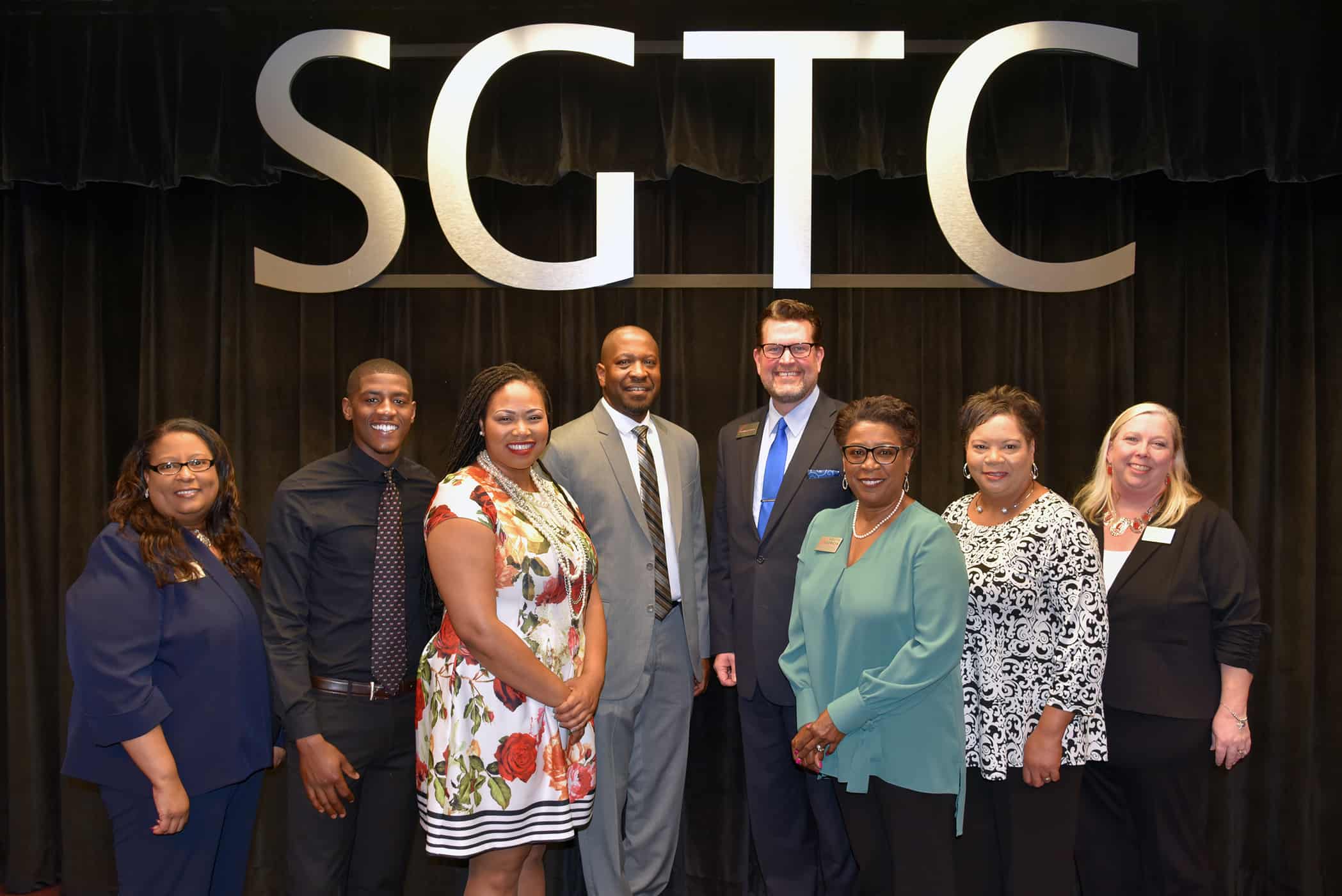 Ronny Roundtree, Jr. (fourth from left) is pictured with African American History Program committee members and speakers, (left to right) Dr. Michele Seay, Christian Holloman, Raven Payne, Dr. John Watford, Cynthia Carter, Teresa O’Bryant, and Teresa McCook.