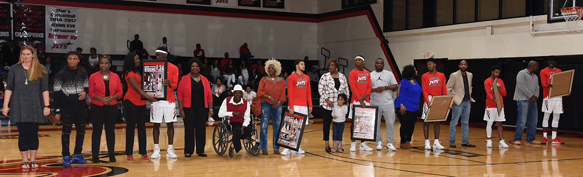 Jets sophomores Mike Boone (5), Emeshuan Offord (12), DeVante Foster (0), Rico Simmons (1), Marquel Wiggins (34), Dawan Bass (11), and Manager Wayne Bell are shown above with family and SGTC faculty and staff.