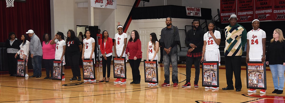 Lady Jets sophomores with family and friends. Shown above are Lady Jets sophomores Dakata Toney (3), Kayla Holmes (4), Esther Adenike (24), Houlfat Mahouchiza (5), Kanna Suzuki (14), and Sceret Ethridge (22) and Davesha Murray with family members and friends.