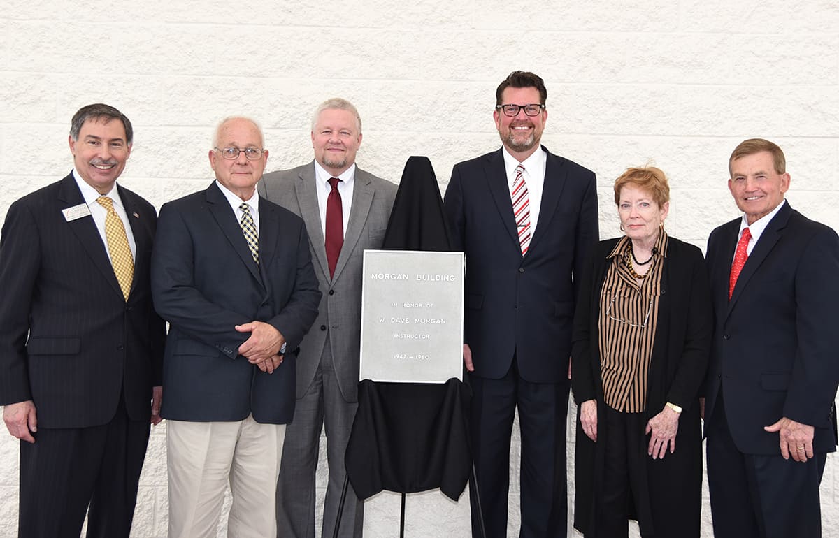 Former State Representative and SGTC Foundation Trustee Mike Cheokas is shown above (l to r) with David Morgan, Commissioner Arthur, SGTC President Dr. John Watford, Marcia Morgan Wright, and SGTC President Emeritus Sparky Reeves are shown with the original plaque dedicating the 1950’s Automotive Building to W. Dave Morgan.