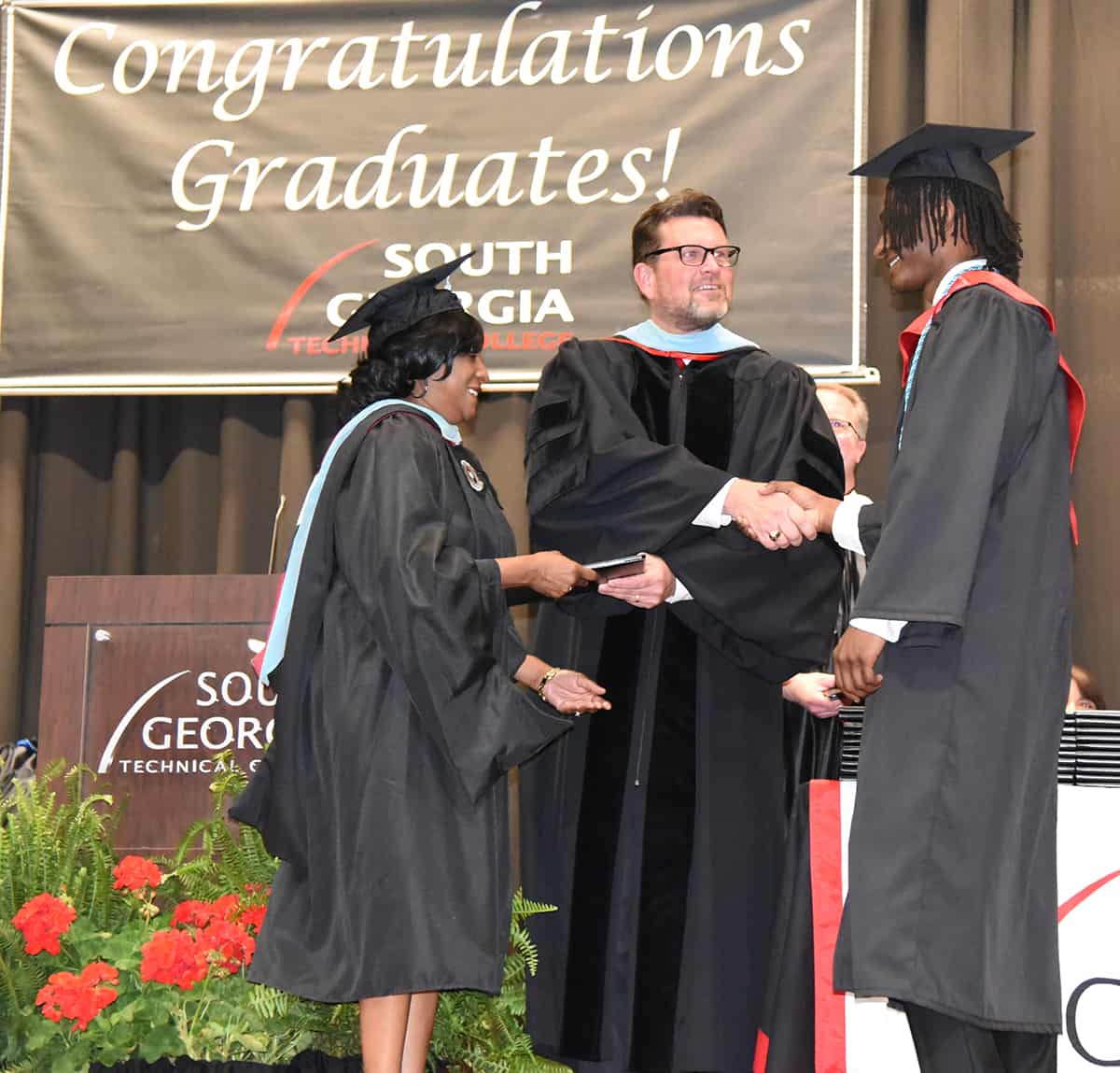 South Georgia Technical College’s Deo Cochran was able to join SGTC President Dr. John Watford in awarding her son, Brandon Cochran with his associate of applied science degree at SGTC.  Brandon Cochran took advantage of the dual enrollment program and earn his associate degree before receiving his high school diploma. 