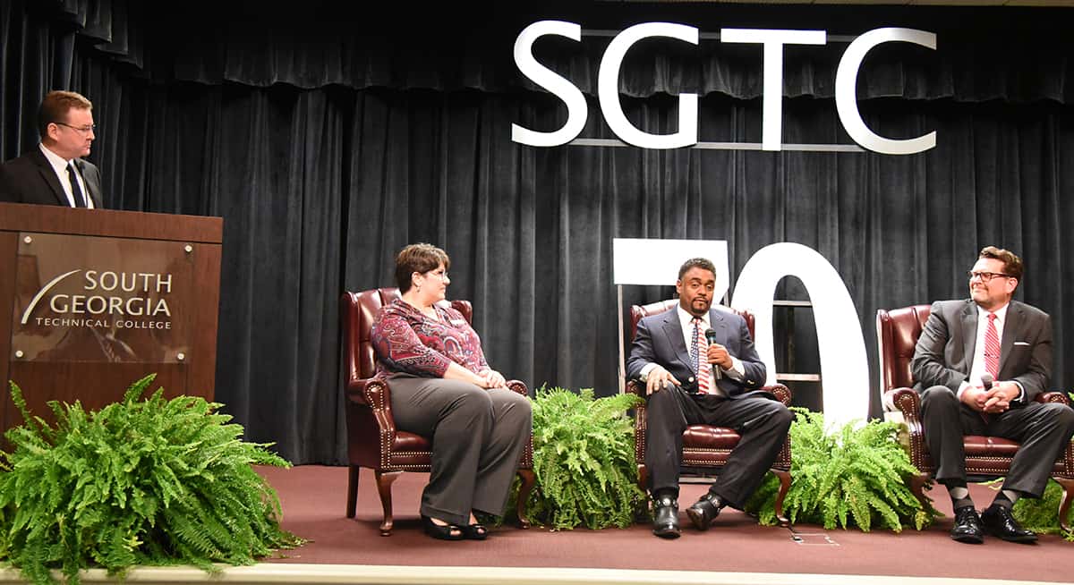 Don Porter, moderator, is shown above asking questions of panelists Dr. Elizabeth Kuipers, Dr. Torrance Choates, and Dr. John Watford.