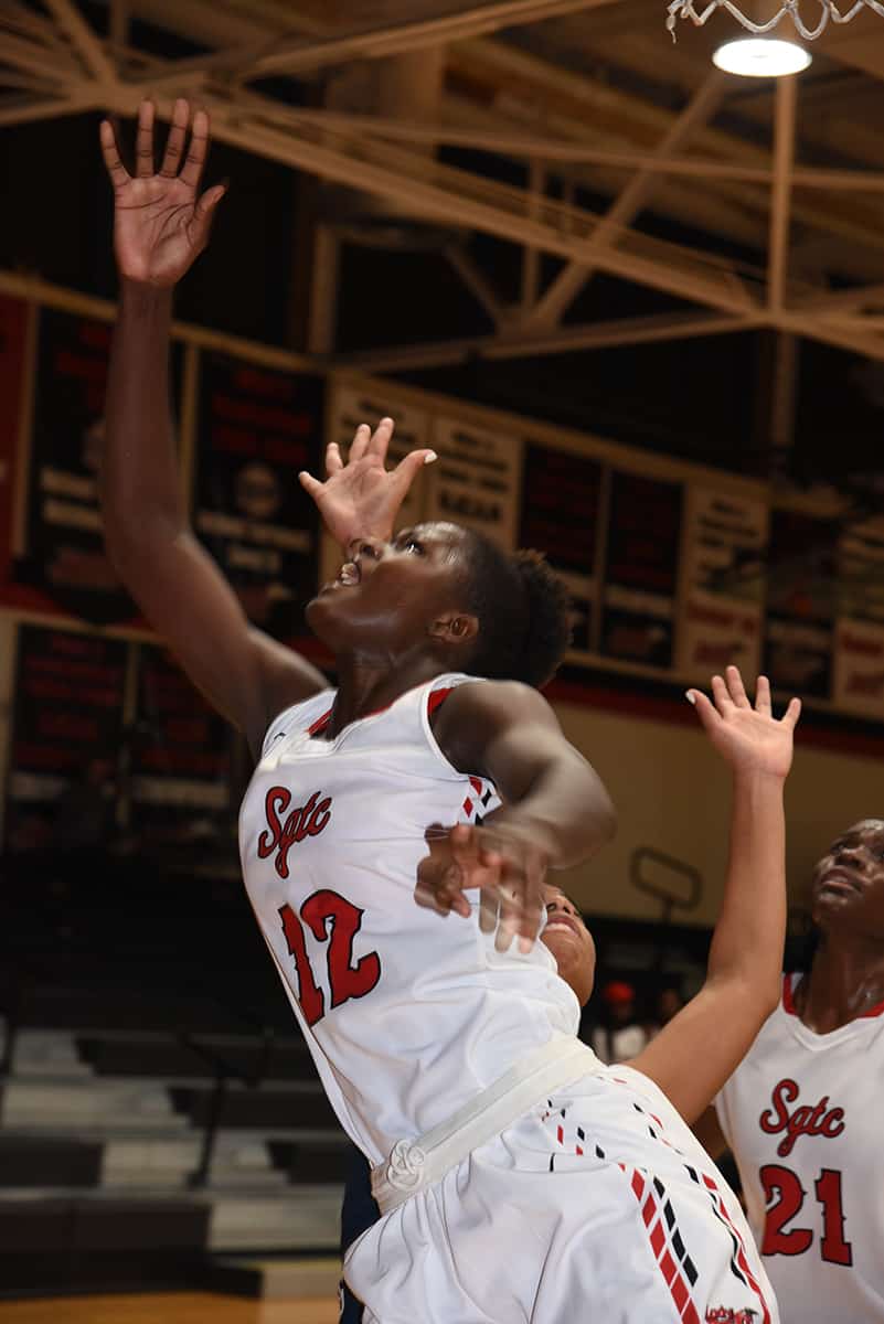 Fatou Pouye, 12, is shown scrambling for a rebound.  She was the second leading scorer for the Lady Jets with 18 points.