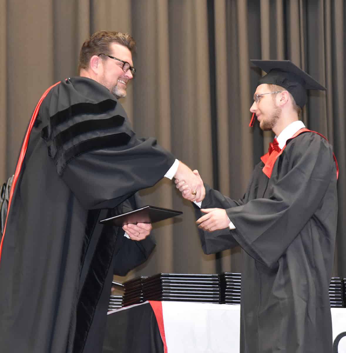 South Georgia Technical College President Dr. John Watford is shown above (left) presenting a diploma to Levi Cowan of Americus who earned his Associate of Applied Science degree in Computer Support Specialist and Networking Specialist.  He has also been hired in the South Georgia Technical College IT department to work in his area of study.