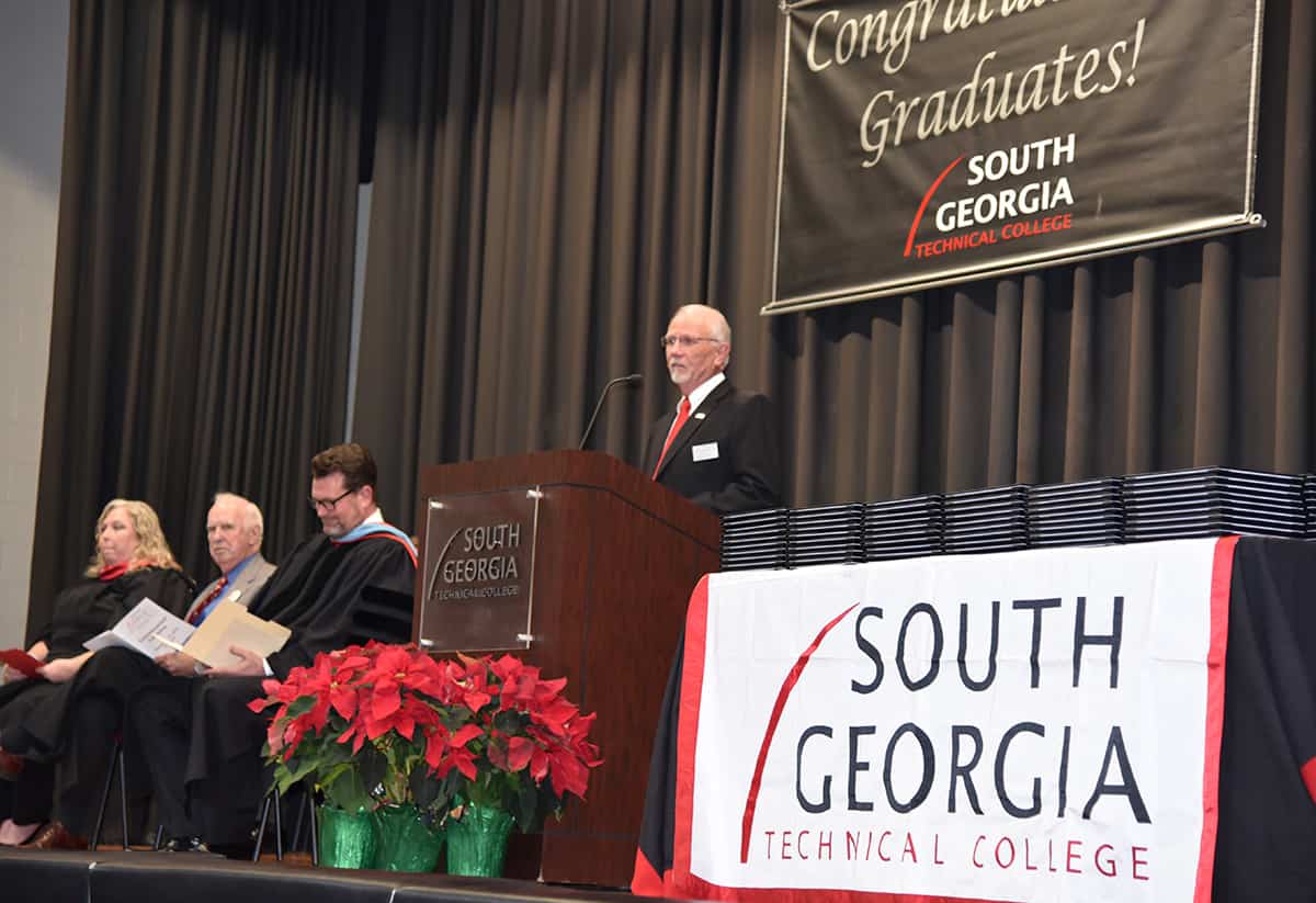 South Georgia Technical College Board of Director Chairman and SGTC Alumni Jake Everett is shown above introducing Criminal Justice Instructor Teresa McCook as the graduation speaker at the Fall 2018 ceremony.