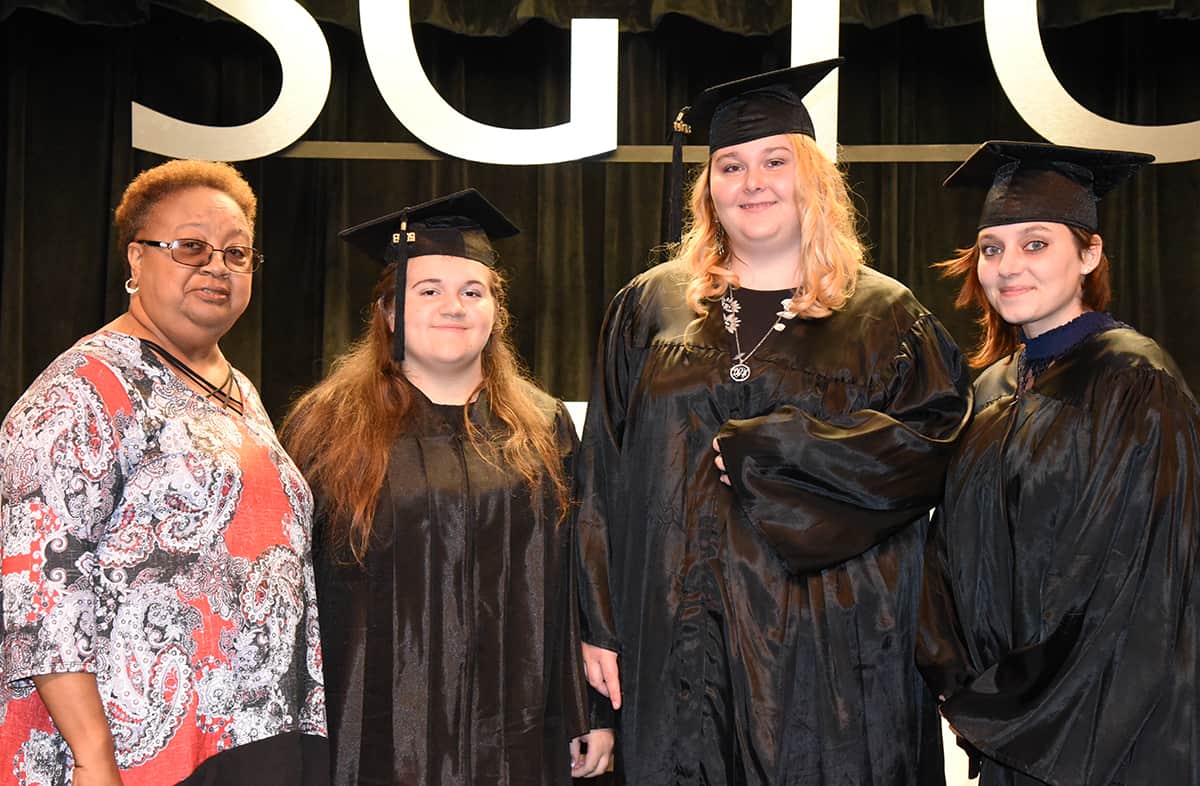 Mary King, GED Instructor is shown above with the Marion County GED graduates that walked at the ceremony.