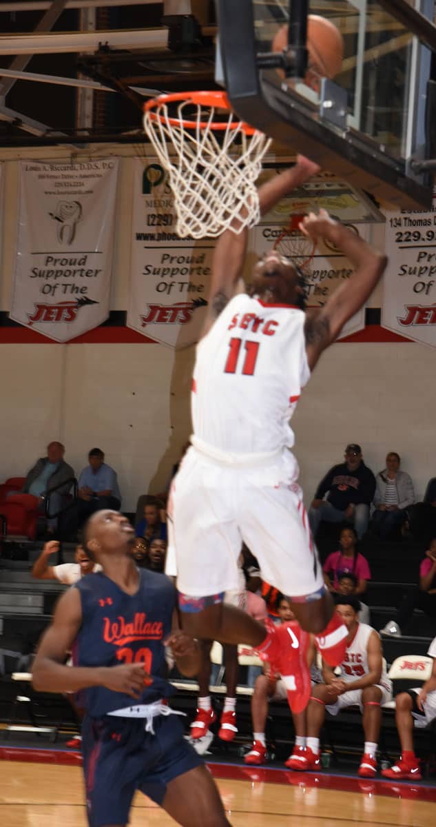 Nick Cummings, 11, is shown going up for a dunk for the Jets in the win over Wallace State.