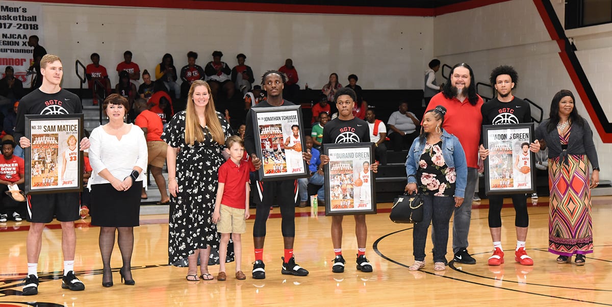 Jets sophomores with their family and friends.  Shown (l to r) are Jets Sam Matice, Jonathan Tchuisee, Durand Green and Adonis Green with their sophomore plaques.