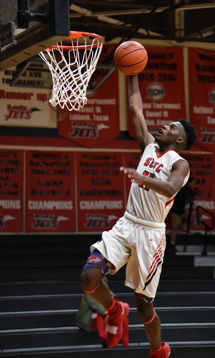 Nick Cummings, 11, goes in for a dunk for the Jets in the win over Central Georgia Tech.