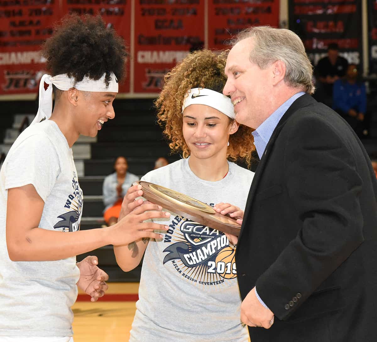 Sophomores Ricka Jackson and Alyssa Nieves accepted the NJCAA Region XVII championship plaque for the Lady Jets from GCAA Commissioner David Elder.