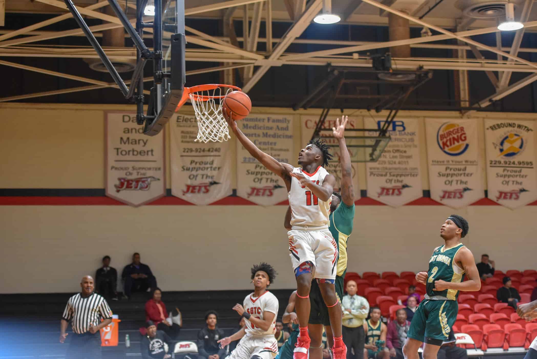 Nick Cummings, 11, is shown driving to the basket against East Georgia State.