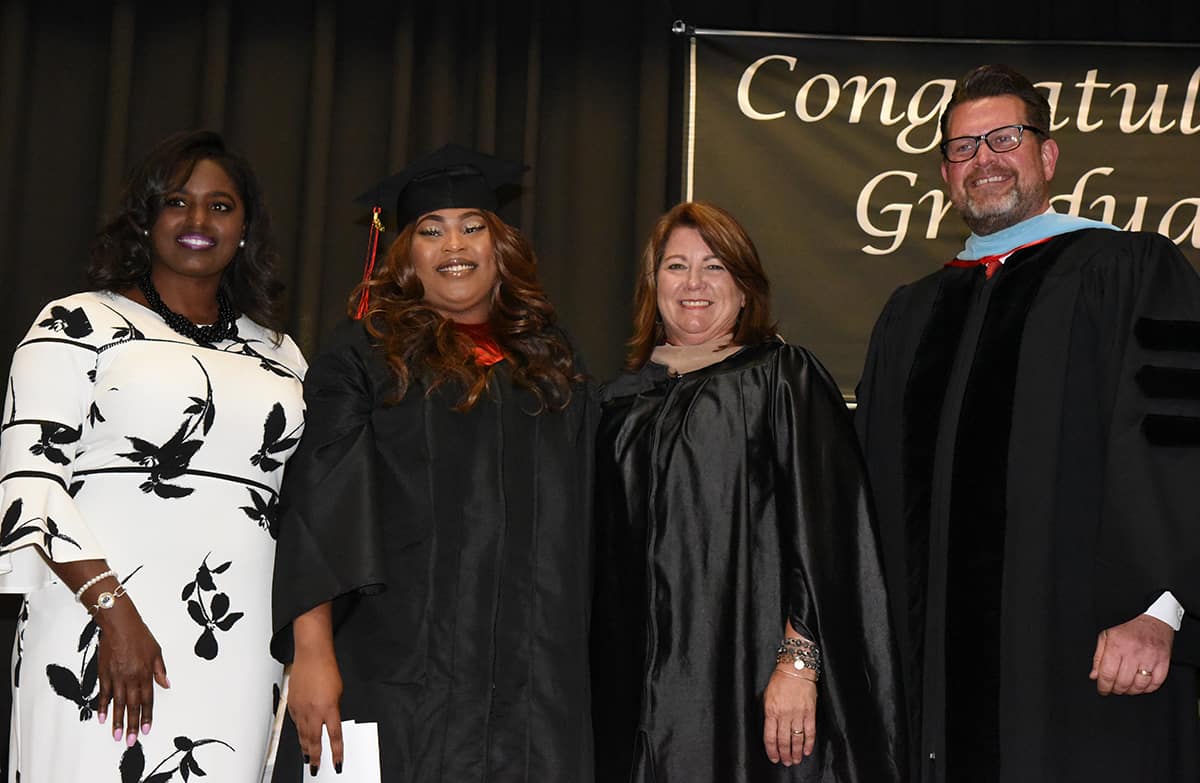 Keisha Hull of REACH Georgia is shown above with Jamera Mitchell and South Georgia Technical College Vice President of Student Affairs Karen Werling and SGTC President Dr. John Watford.  Mitchell was the first REACH student to graduate from a Technical College System of Georgia Institution.