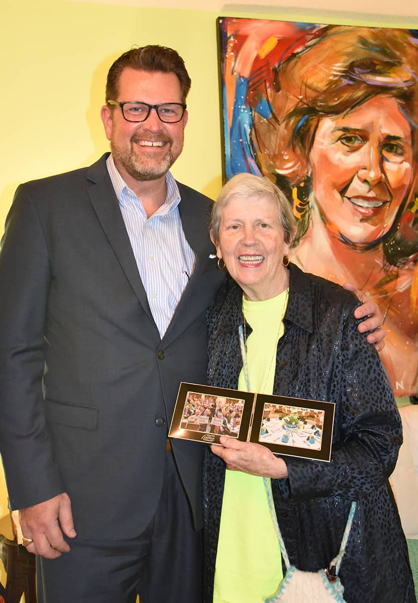 South Georgia Technical College President Dr. John Watford is shown above presenting Ruth Jones with a framed photo of the SGTC Foundation donors thanking her for her time and talent to decorate for this community event each year.