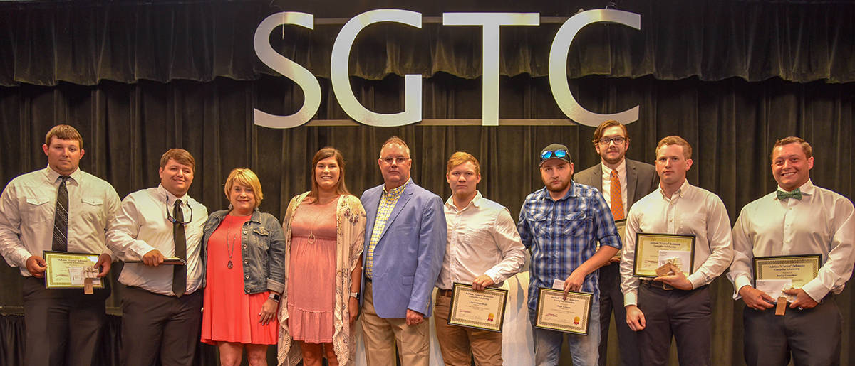 Shown above (l to r) are the first recipients of the Adrian “Goose” Johnson CAT Thompson Tractor Tool scholarships: Tyler Singletary, Ethan Wendell, Goose’s family Amber Johnson, Sarah Johnson and Kelly Johnson, Logan Crutchfield, Noah Schrum, Ben Selman, Cole Holland, and Justin Greenhaw.