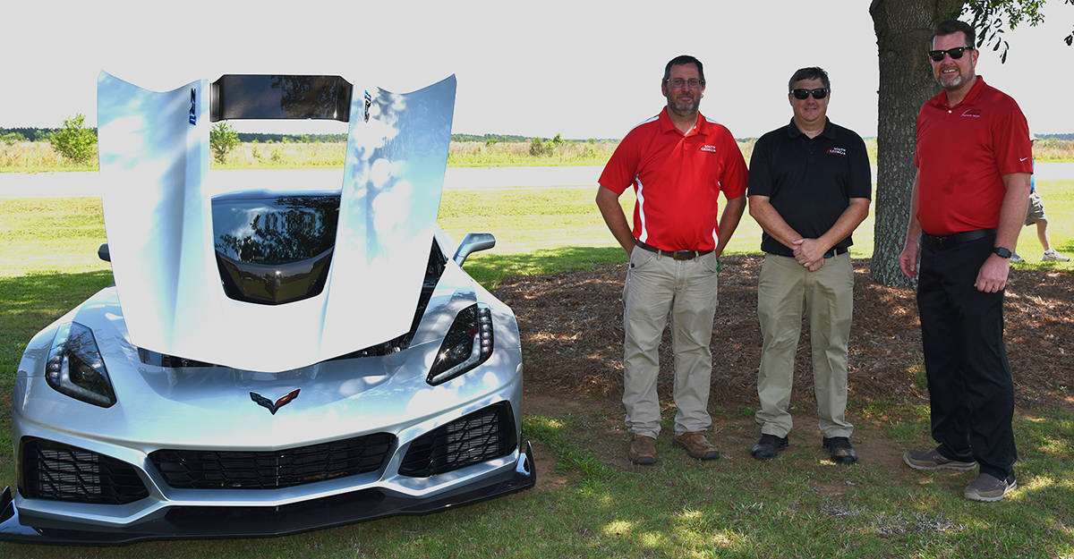 South Georgia Technical College President Dr. John Watford (right) is shown above with Matthew Burks and Kevin Beaver looking at Michael Mathews 2010 Chevrolet Grant Sport/Corvette that took third place in the Best of Show 1994 – Present category.