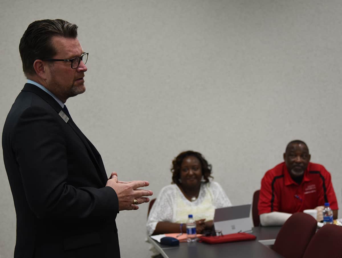 Dr. John Watford is shown speaking with SGTC’s LaKenya Johnson and Sammy Stone in the background.  Johnson, Stone, and Nancy Fitzgerald represented South Georgia Tech at the meeting.