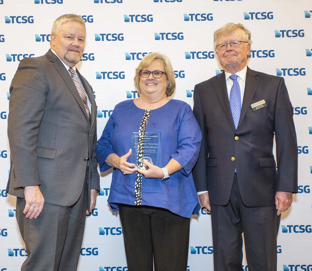 Technical College System of Georgia Commissioner Matt Arthur is shown above presenting the award for Elizabeth “Betty” Deriso Pope to her daughter Kerri Post. Technical College Foundation Association Chairman John DeVeer is also shown.