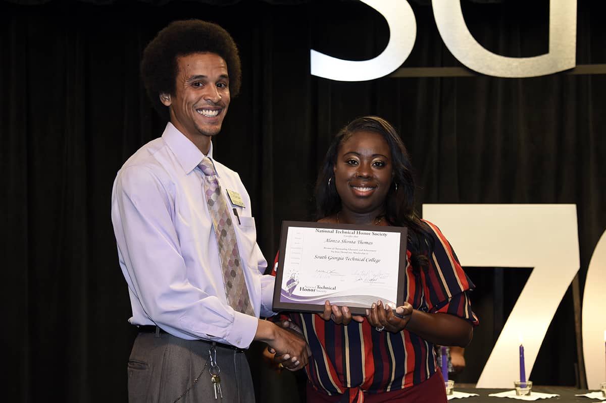  SGTC mathematics instructor Chester Taylor with NTHS inductee Alonza Thomas