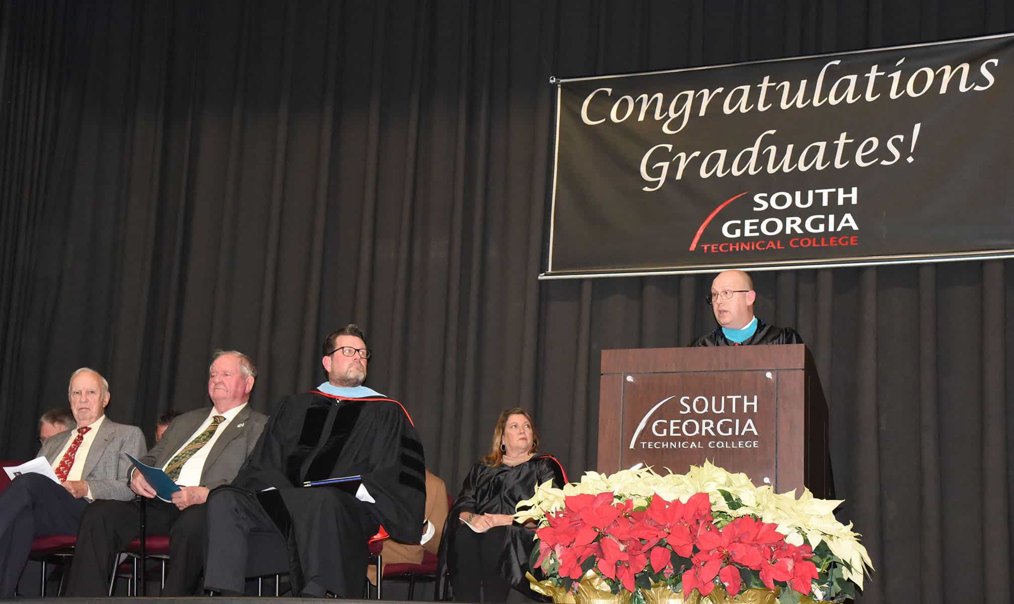 Brett Murray is shown above delivering the graduation speech at the SGTC Fall 2019 graduation.