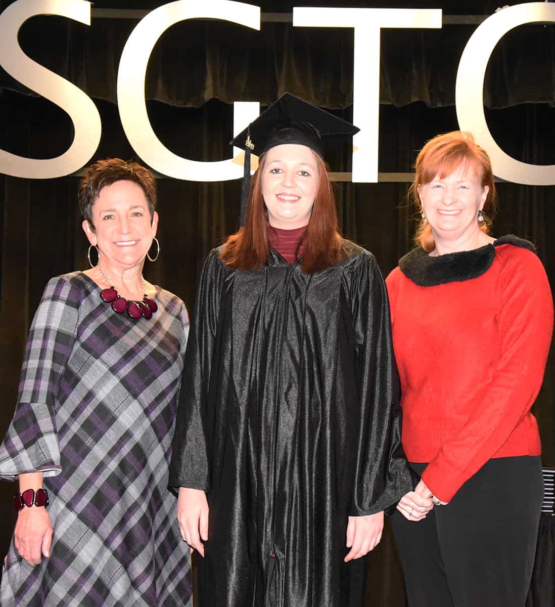 Macon County GED graduate Rebecca Dowdy is shown above with Adult Education Dean Lillie Ann Winn and instructor Angie Kauffman.