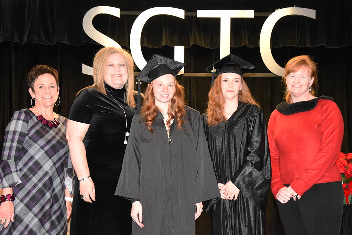 SGTC Schley County GED graduates Michelle Grinolds and Colby Register are shown above with Dean Lillie Ann Winn and instructors Alana Goolsby and Angie Kauffman.