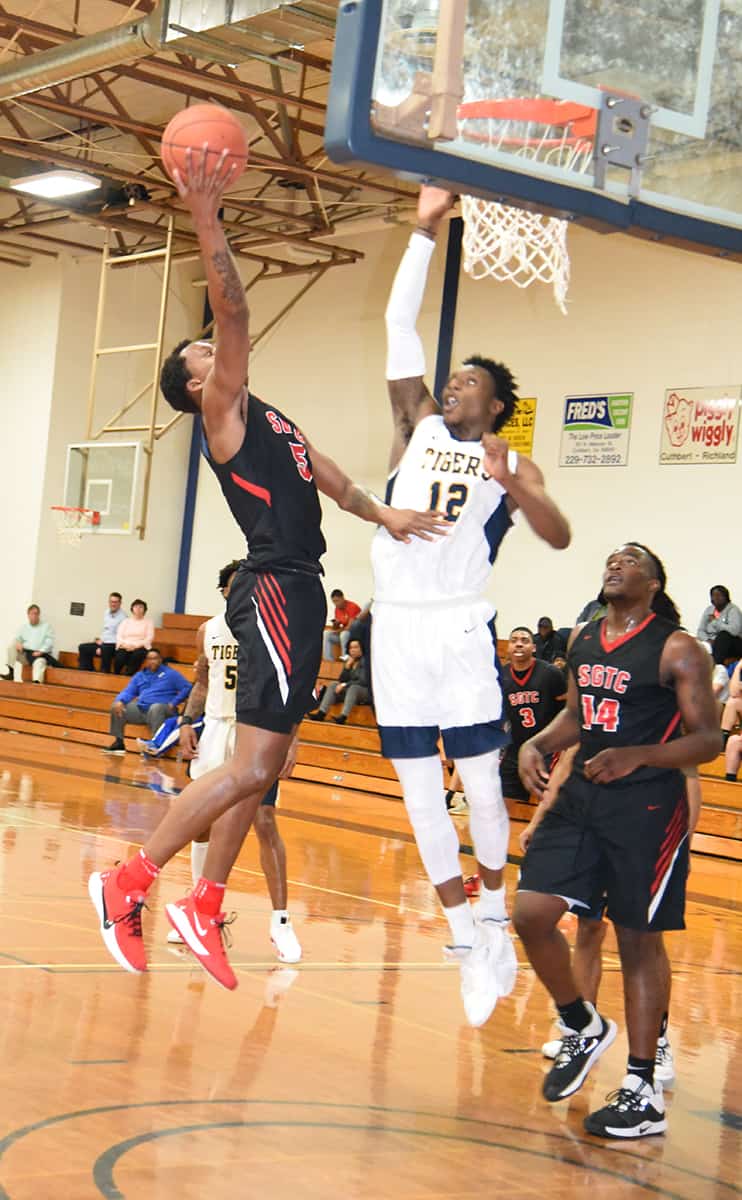 Justin Johnson, 5, goes up for a layup for the Jets.