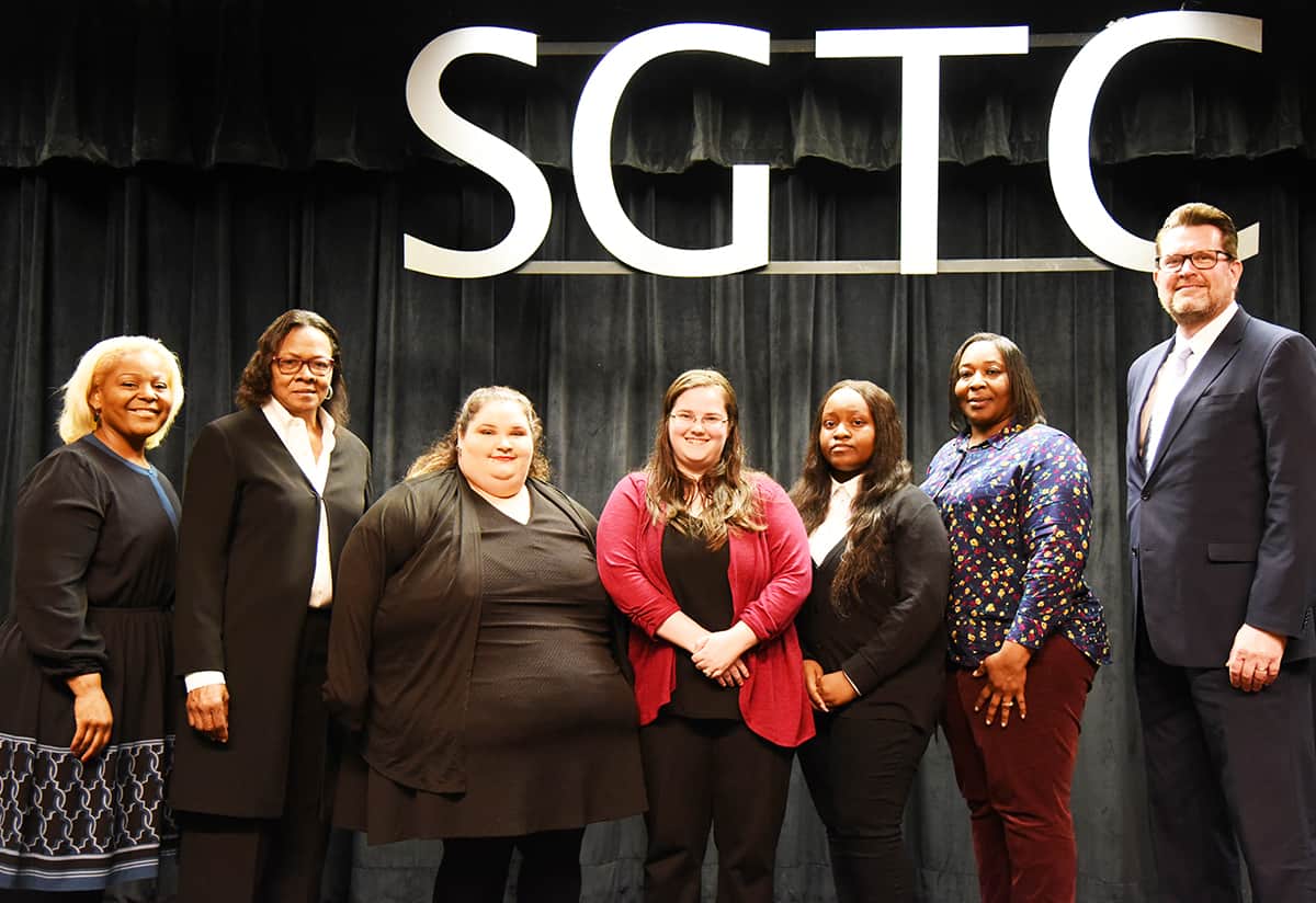 SGTC President Dr. John Watford (right) is shown with SGTC PBL Advisor and Academic Dean Dr. Andrea Oates, and PBL club members Alexis Anders, Ashley Halstead, Heather Hinton, Kenyatta Slaughter and Taylor County CTAE Director Michele Kimble.