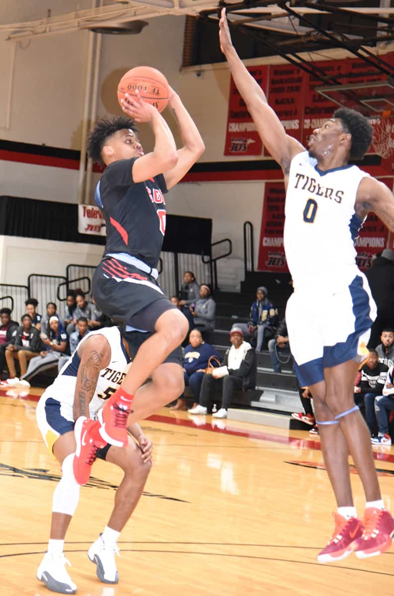 Sophomore Toriano Lewis, 0, drives for the basket.  He had 12 points for the Jets.