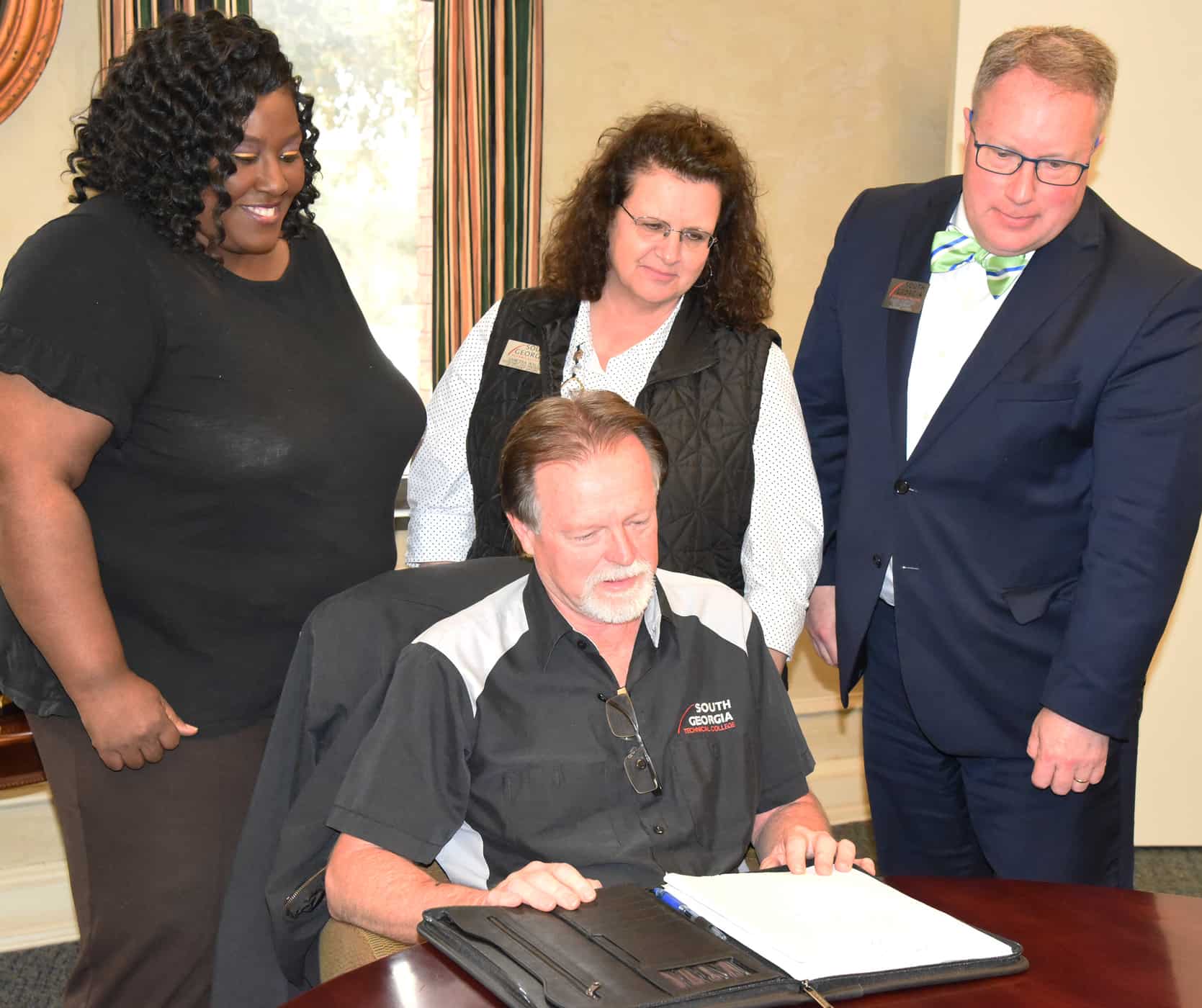 South Georgia Technical College Vice President of Student Affairs Eulish Kinchens, Assistant Vice President of Student Affairs Vanessa Wall, and Vice President of Academic Affairs David Kuipers are shown above with SGTC Director of Maintenance looking at plans to make sure that the SGTC public areas that have high amounts of human contact are regularly cleaned and disinfected.  The preventive task force also discussed preventative measures to alert the campus to best practices for avoiding the COVID-19 virus and other flu-related illnesses.