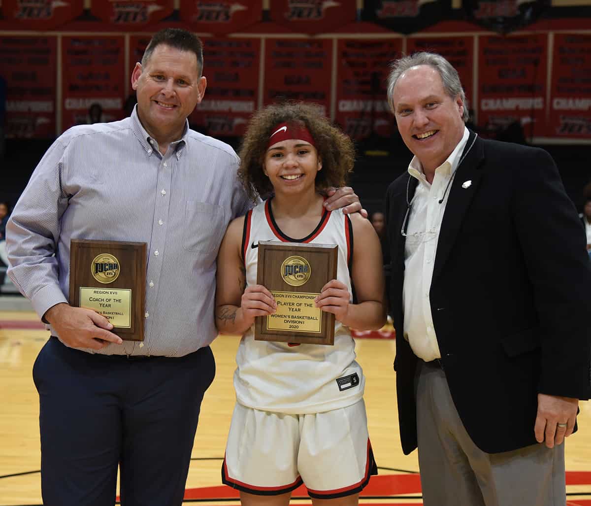 GCAA Commissioner David Elder is shown above presenting SGTC Lady Jets head coach James Frey with his GCAA Coach of the Year award and Lady Jets Shamari Tyson with the GCAA Division I women’s Player of the Year award.