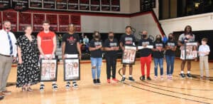 Jets interim head coach Chris Ballauer and his wife, Ivy, are shown above with the Jets sophomores:  Nikola Sasarog, Tobais Long, and Jordan Stephens and his family members including his parents Georglyn and Anthony Stephens and his sisters Kennedy, Kaelyn and Kandace Stephens and sophomore Jalen Reynolds with Coach Ballauer’s daughter, Layla and son, Hutch.