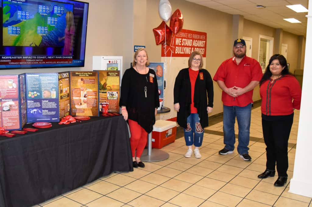 Pictured with the SGTC Red Ribbon Week display are (l-r): SGTC Criminal Justice Instructor Teresa McCook; Diesel Technology student and SGA President Donald Gay; Criminal Justice student and SGA member Kimberly Sadecki; and SGTC WIOA Coordinator Sandhya Muljibhai.