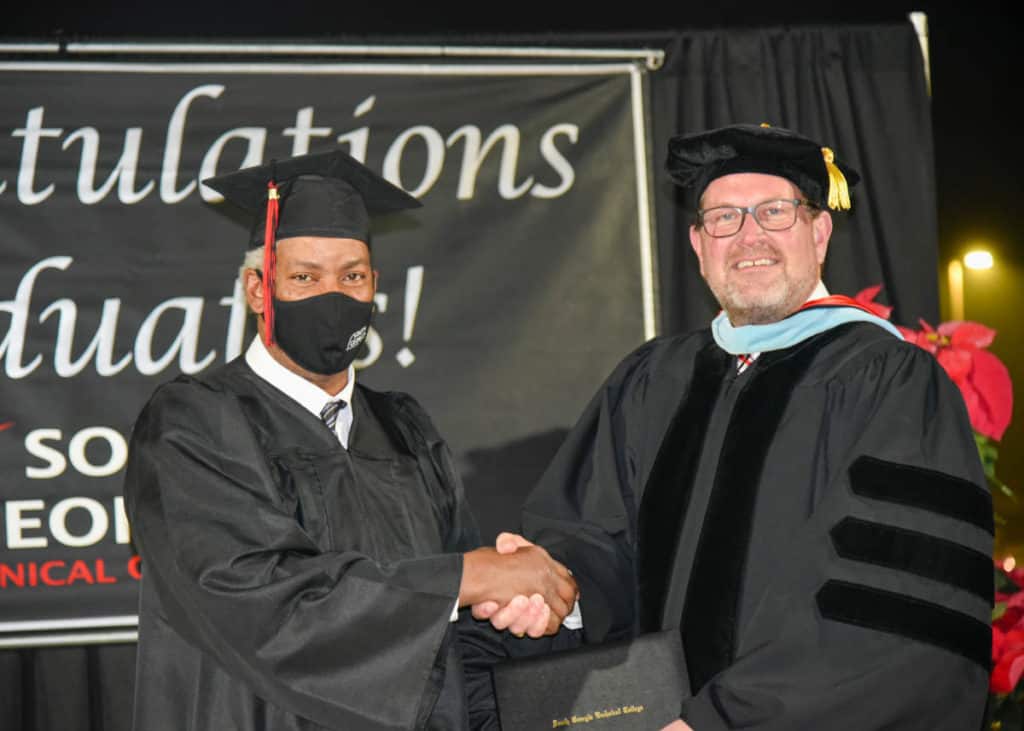 SGTC President Dr. John Watford congratulates graduate Lonnie Rogers at the recent South Georgia Technical College Fall Commencement ceremony.