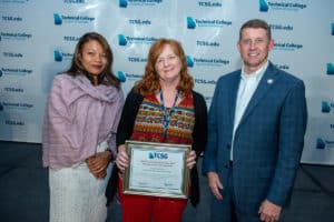 SGTC Adult Education Instructor Angie Kauffman (center) with TCSG Commissioner Greg Dozier and TCSG Assistant Commissioner for Adult Education Dr. Cayanna Good at the TCSG Dinah Culbreath Wayne EAGLE conference.