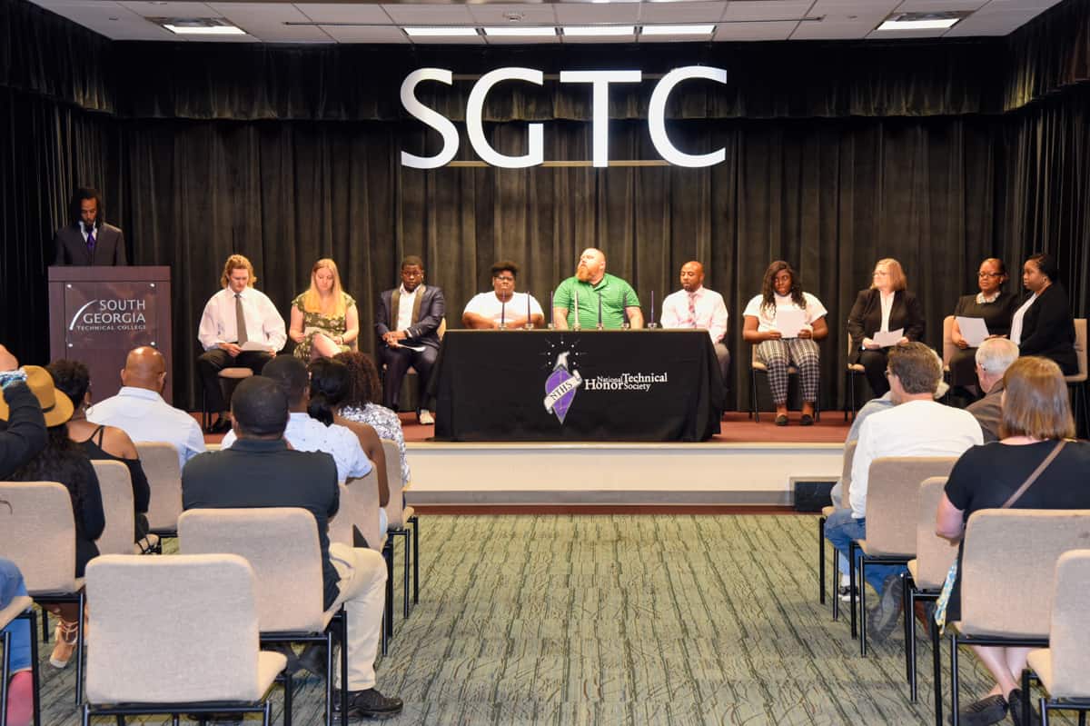South Georgia Technical College Mathematics Instructor Chester Taylor (at podium) addresses the new SGTC inductees into the National Technical Honor Society at a recent event on the SGTC campus in Americus.