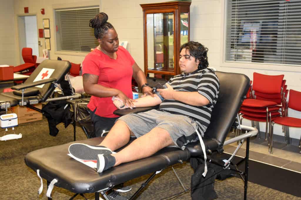 South Georgia Technical College Drafting student Zak Mahamood donates blood at a recent blood drive. SGTC will host another Red Cross blood drive on September 13.