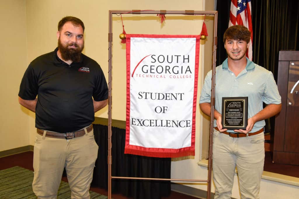 SGTC Student of Excellence winner Charlie Collins (R) with horticulture instructor Brandon Gross.