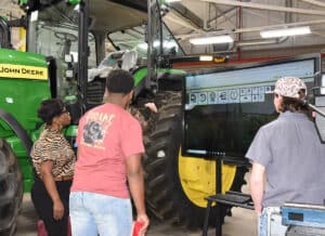 SGTC current John Deere Agricultural Technology students are shown above conducting demonstrations in the John Deere Tech labs at SGTC.