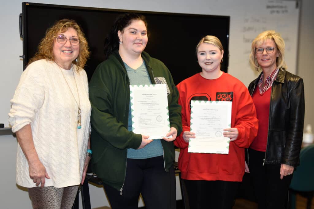 Pictured (l-r) are SGTC Nurse Aide instructor Janice Wiseman with graduates Emily Born and Brooke Parrish and SGTC Vice President of Academic Affairs Julie Partain.