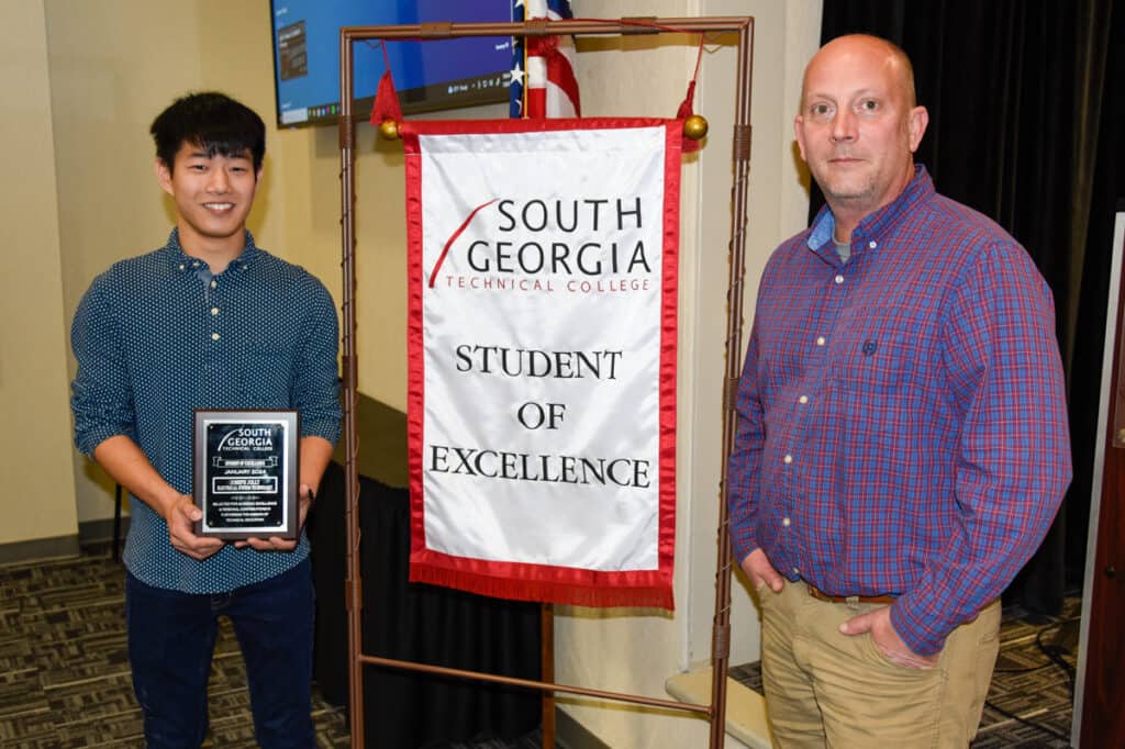 Student of Excellence Joseph Jolly (left) and his instructor, Patrick Owen.