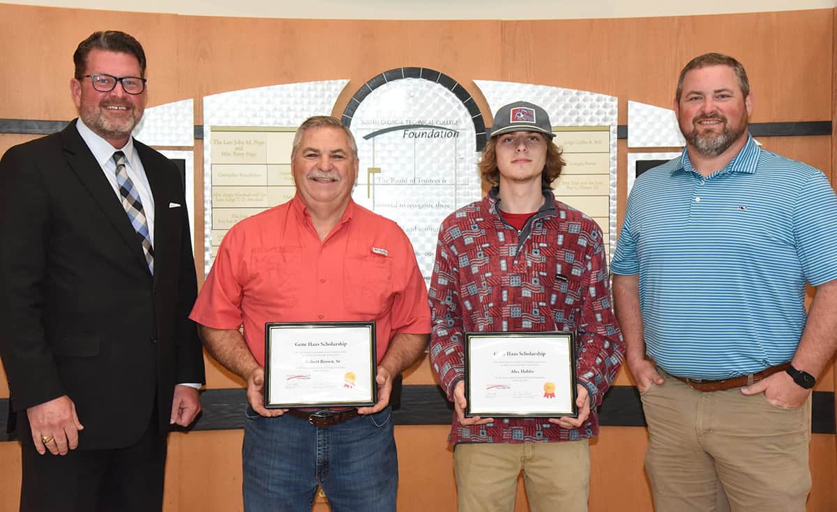 South Georgia Technical College President Dr. John Watford (left) is shown above with SGTC Precision Machining and Manufacturing students and Gene Haas Scholarship winners Robert E. Brown, Jr. and Alec D. Hobbs and Instructor Chad Brown.