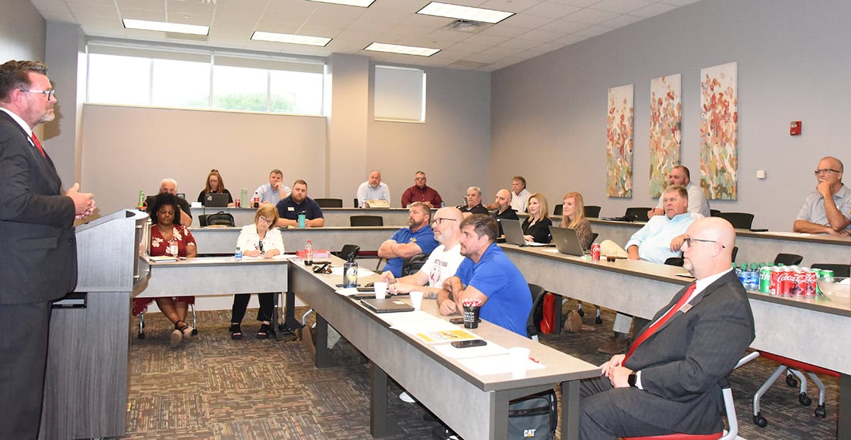 Shown above is SGTC President Dr. John Watford, talking with members of the CAT Think Big Advisory Committee and with SGTC administrators who work with the CAT Think Big program and students.